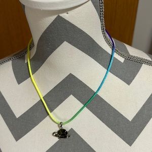 Kids 16” nylon ombré necklace with a silver turtle pendant green accents. Used